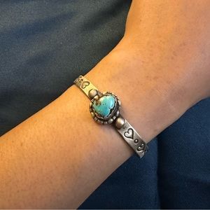 Cute turquoise cuff with hearts on band